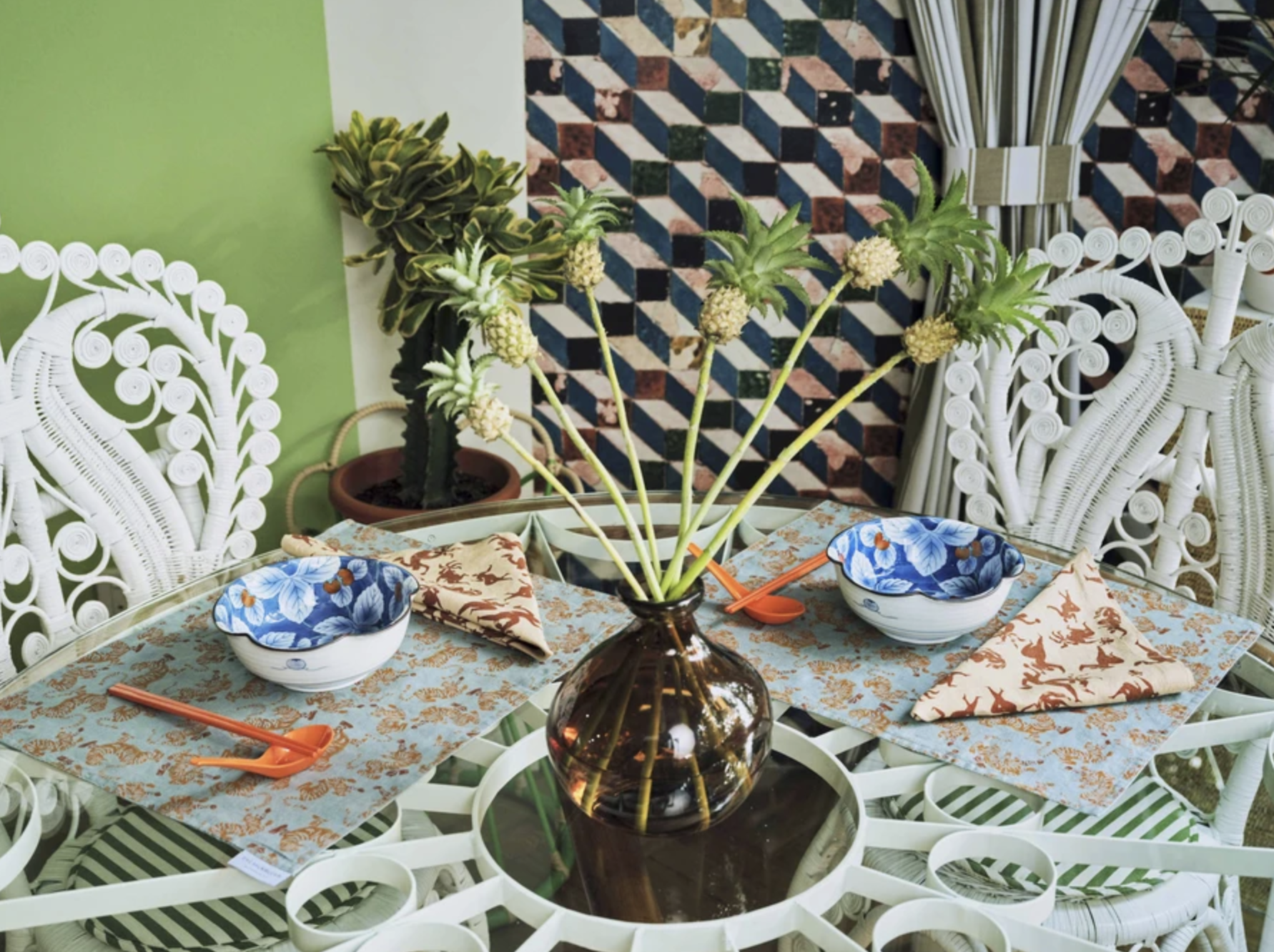 Arty Guava’s nature-inspired art adorns Ong Shunmugam’s luxury homeware collection, including napkins, placemats, and throw blankets.