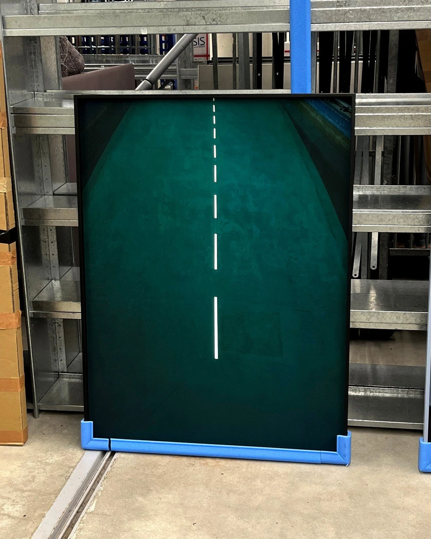 My series New Wave (TU Delft) in the Delft University of Technology library's depot. These works, showing different locations on the campus in a tranquil moment - for example, the water tank the Towing Tank-, are part of the collection and the new ar