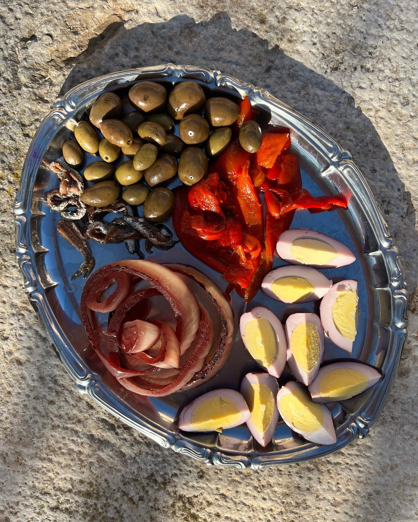 Today&rsquo;s pickle plate full of goodies: olives, roasted red pepper, red wine vinegar pickled eggs, charred pickled onion and our anchovies. A great way to start a meal.