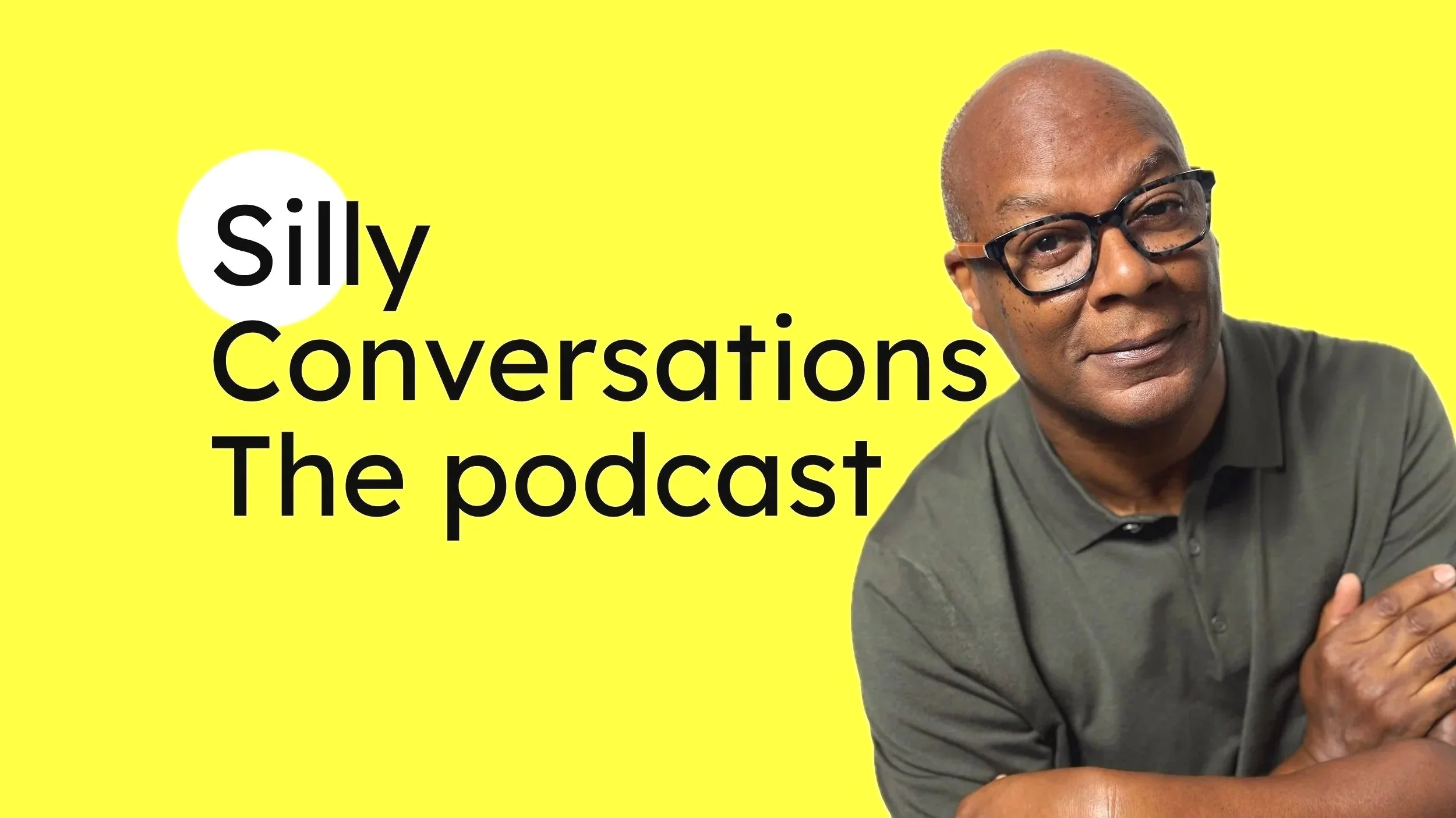 Podcast 'Silly Conversations The podcast' featuring Denzle Mills with glasses wearing a dark green shirt, against a bright yellow background. Text reads 'silly Conversations The podcast'.