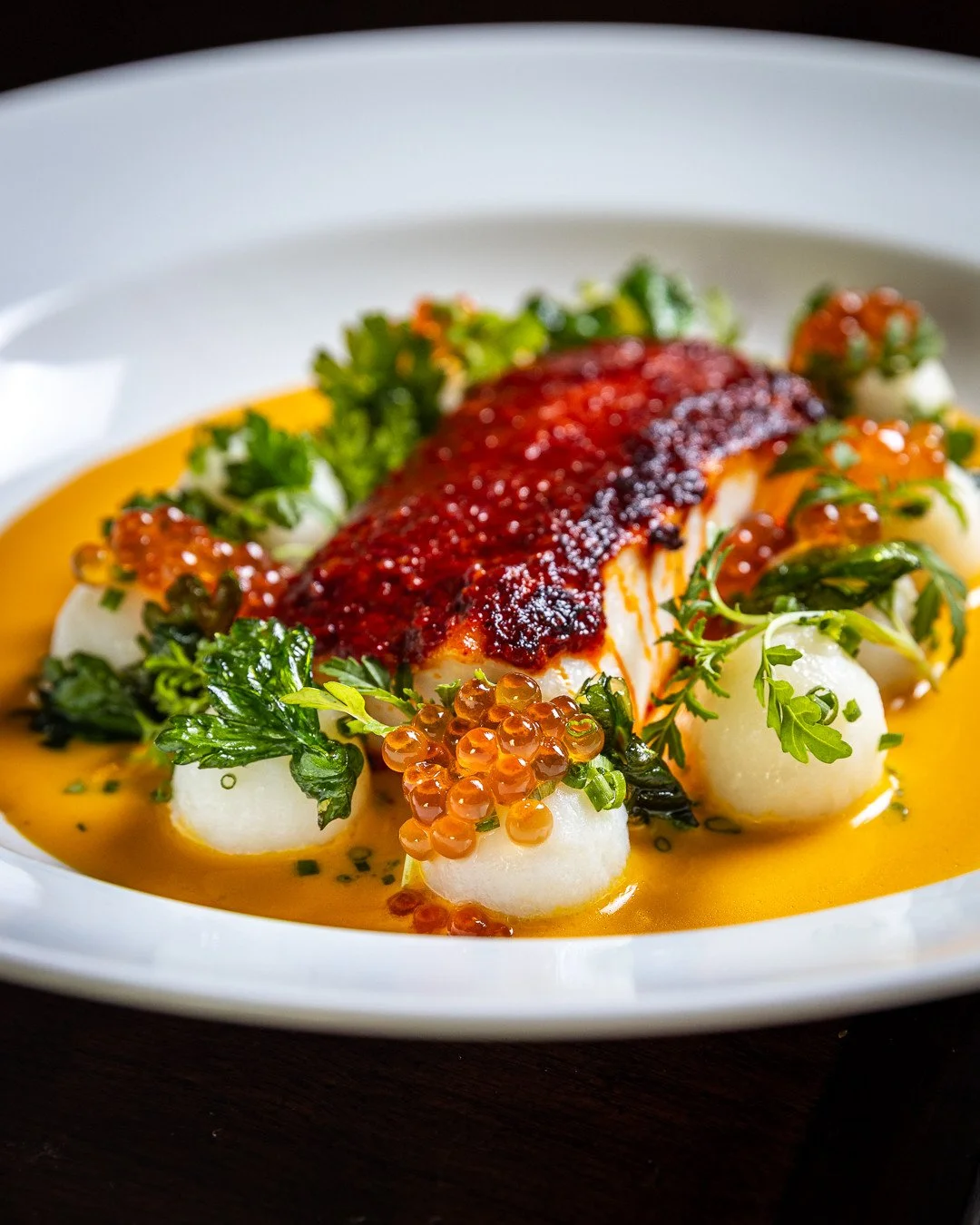 When the food makes your job easy.⁠
⁠
Black cod with an 'nduja crust, Parisienne potatoes, fermented carrot beurre blanc, ikura. Shot this back in March and that sauce has been living rent free in my head ever since.⁠
⁠
Coming from a kitchen backgrou