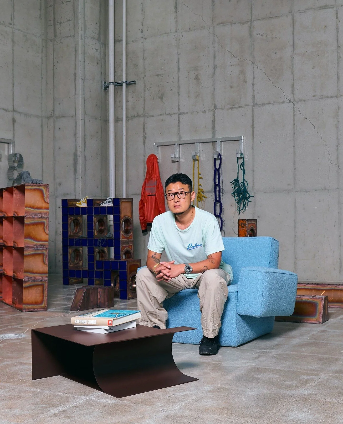 Designer @_kwangho_lee sitting in his Hunk chair designed for @hem with his range of Glyph tables also produced for Hem.⁠
⁠
Images courtesy of @hem