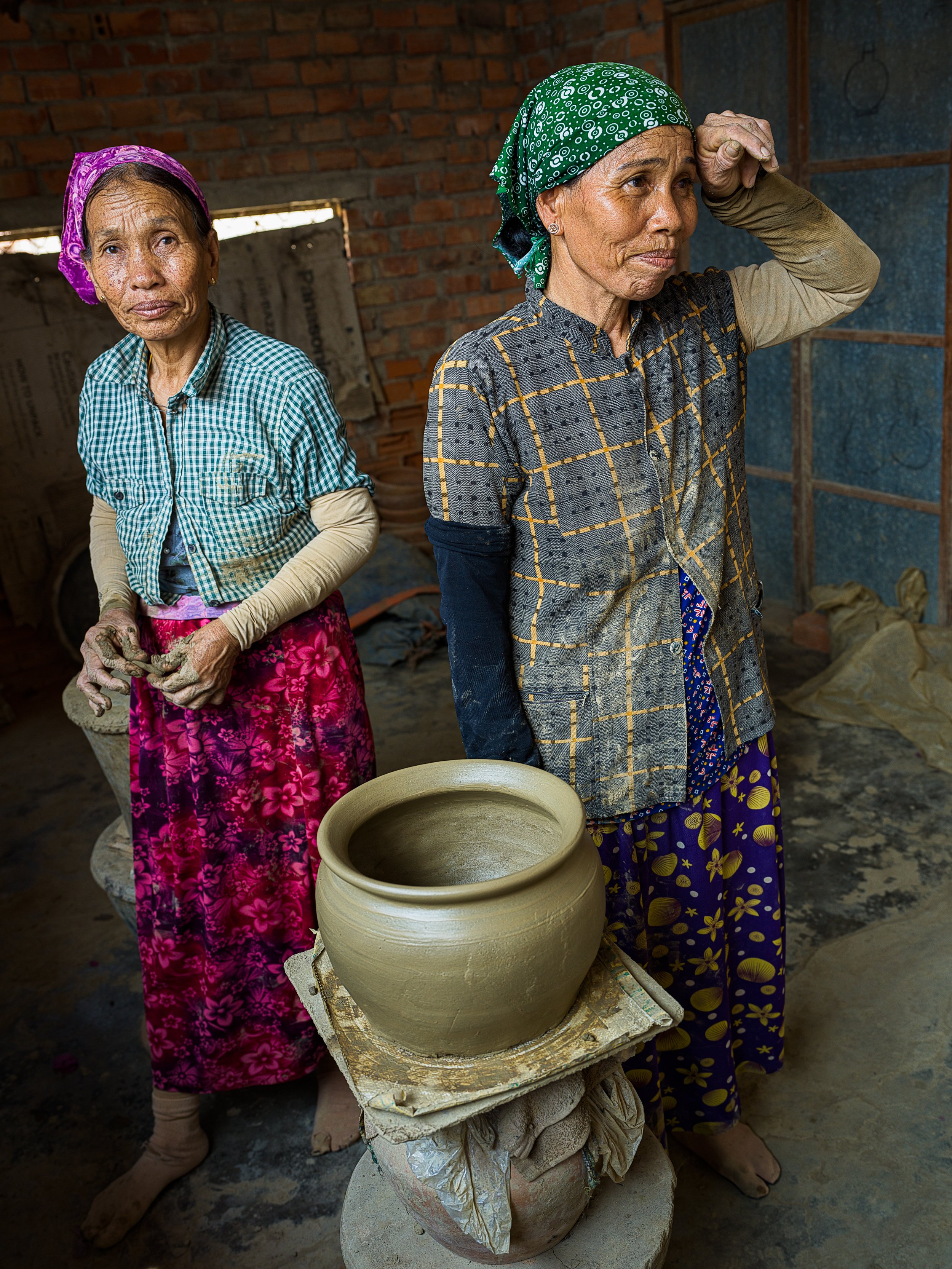  two cham lady potters in a village in ninh thuan province, vietnam 