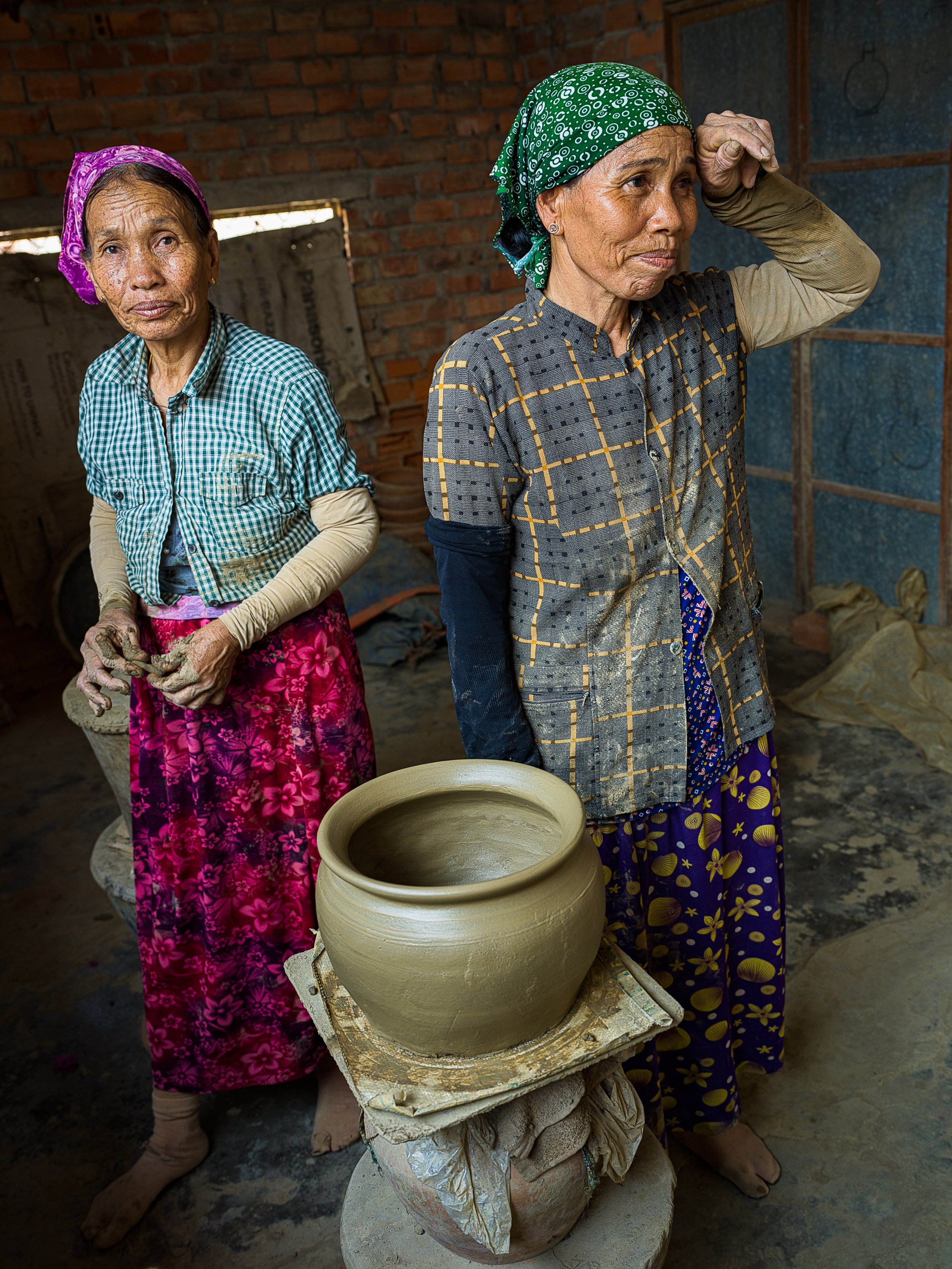two cham lady potters in a village in ninh thuan province, vietnam