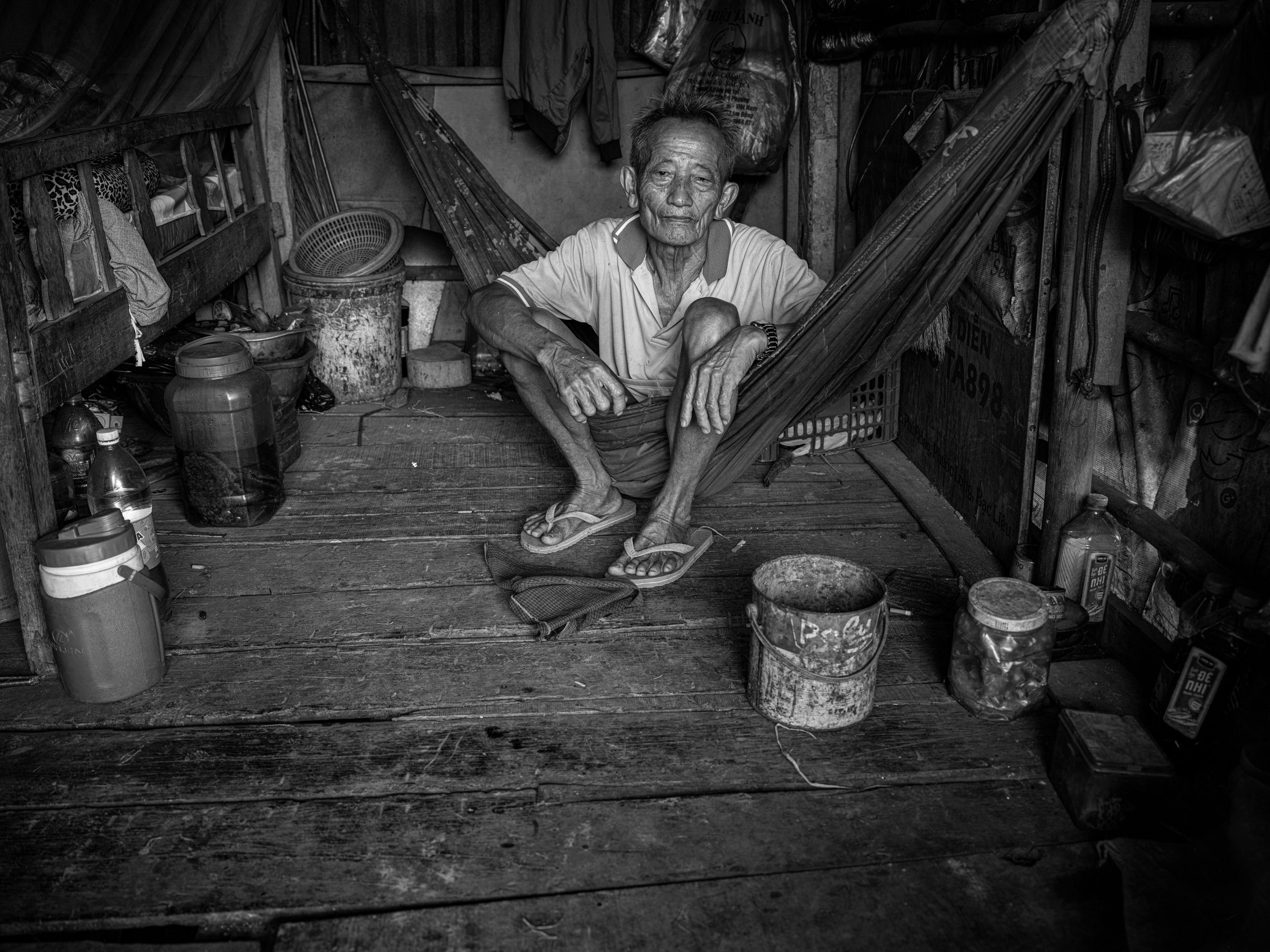  banana seller in his roadside house,soc trang province, vietnam 