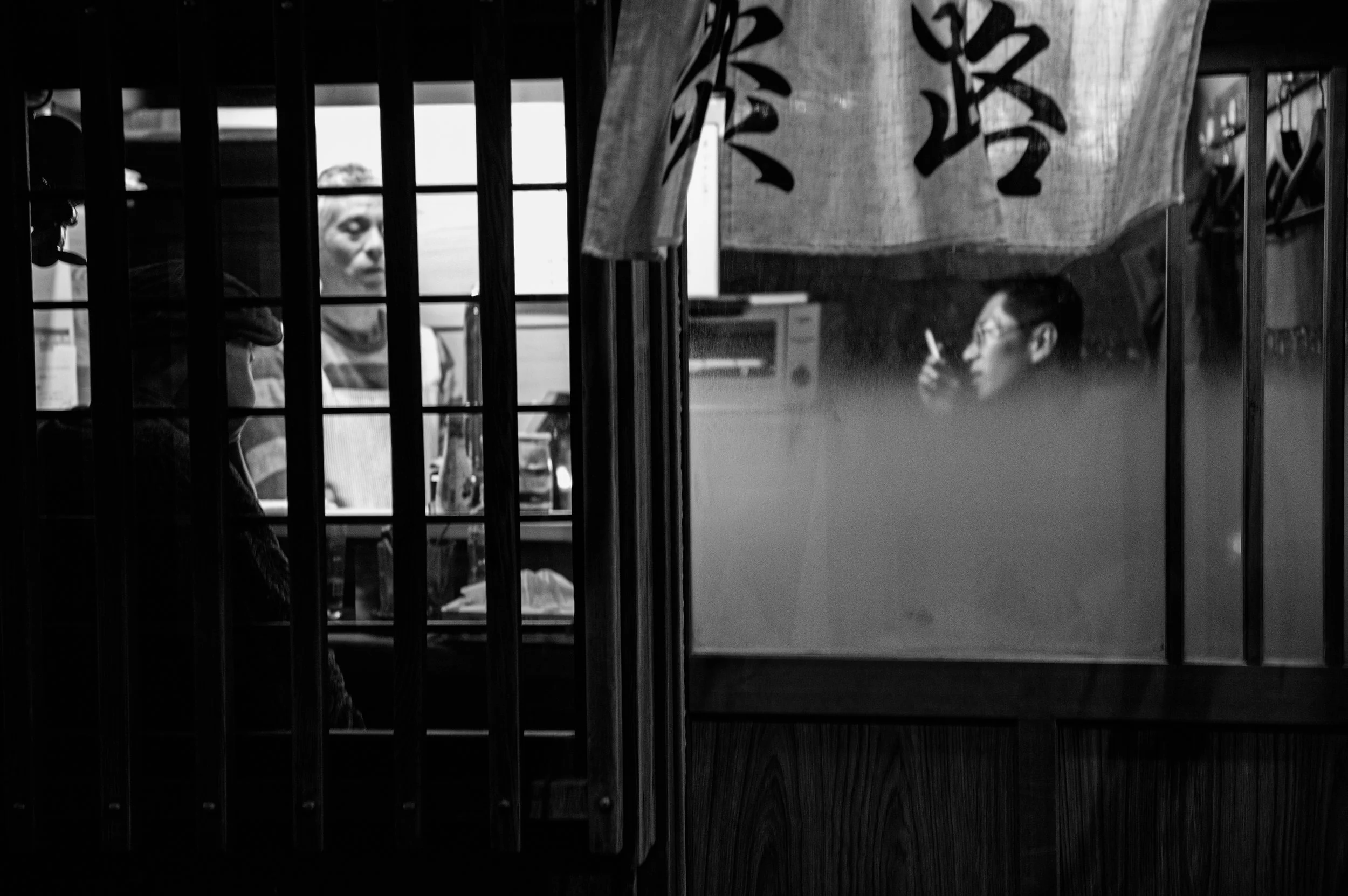 one of the many small drinking bars in the golden gai area of shinjuku , tokyo