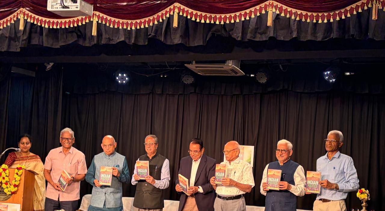 Releasing the book Decoding Indian Politics authored by Dr PS Jayaramu and speaking on the occasion.