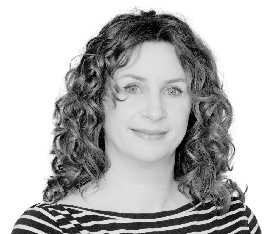Black and white portrait of a woman with curly hair wearing a striped shirt.