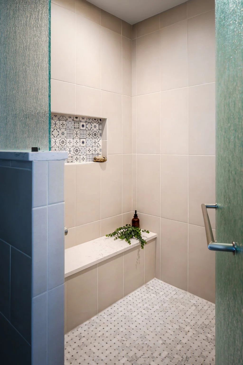 Spa Shower Design with Marble Mosaic Tile and Etched Glass by Singer Interiors Sarasota Florida