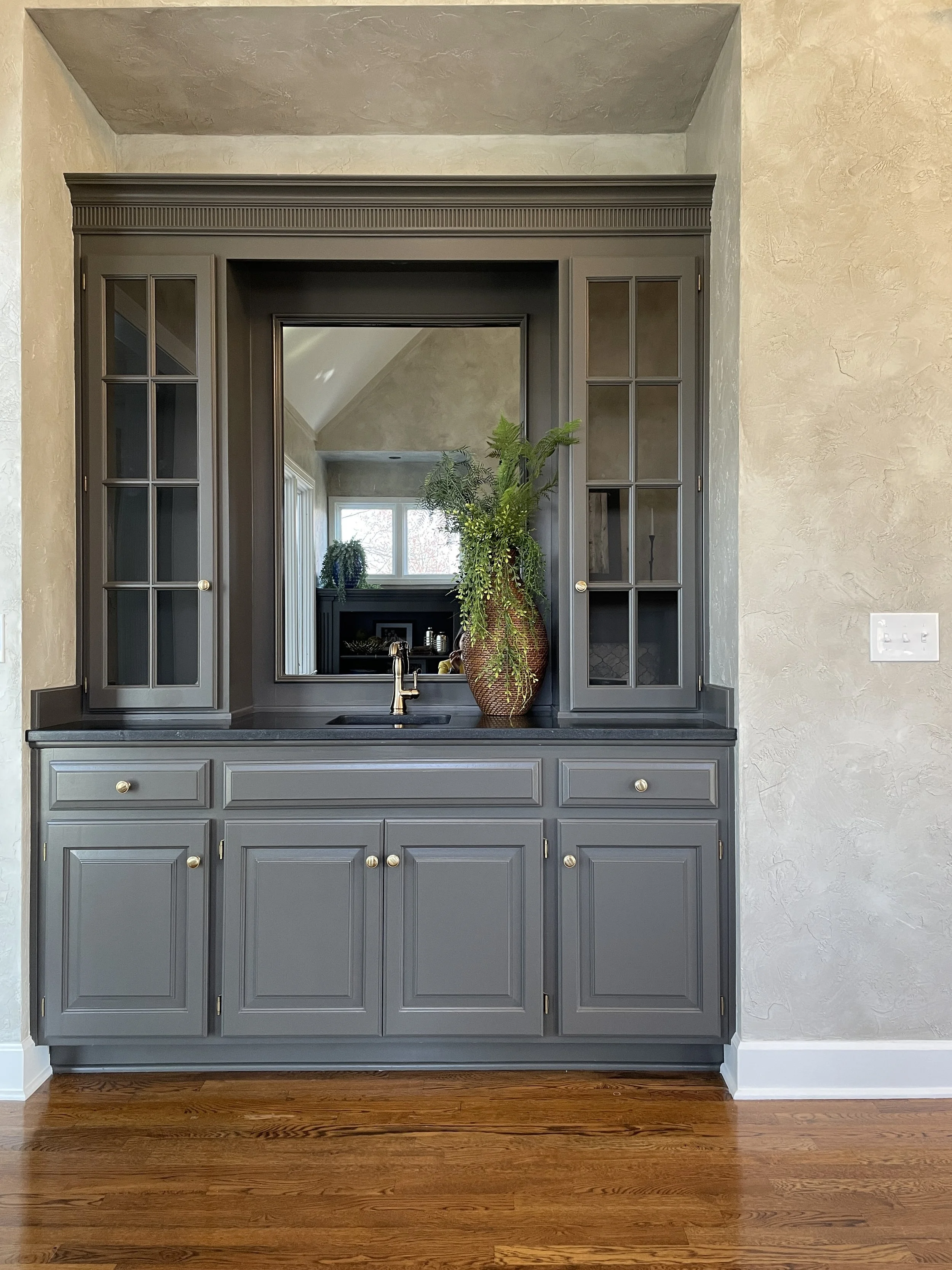 Urbane Bronze Wet Bar Remodel with Gold Traditional Hardware by Singer Interiors Venice Florida
