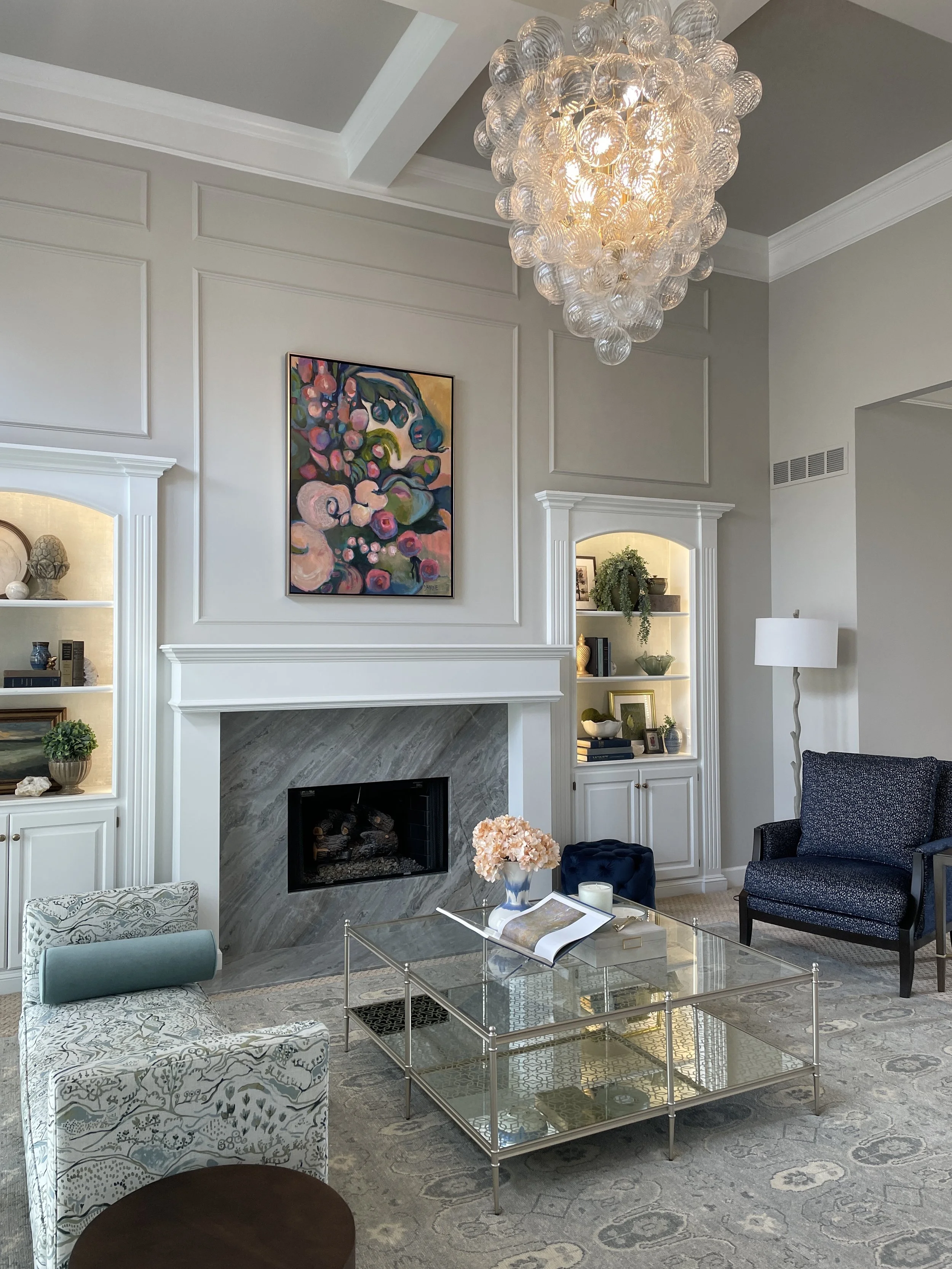Beautiful Transitional Style Living Room Renovation with Visual Comfort Chandelier and Caracole Coffee Table