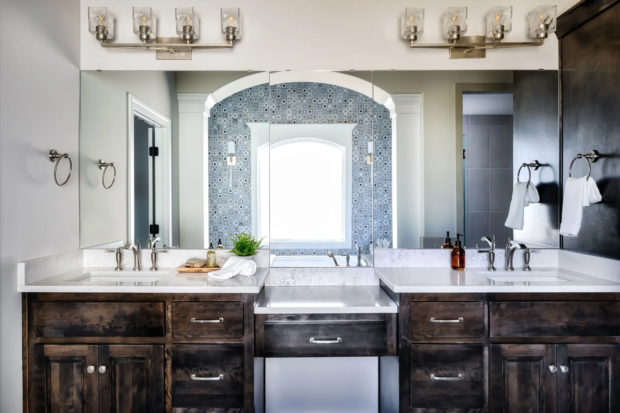 New Home Design Selections by Singer Interiors Primary Bathroom Vanity with Mixed Metal Hardware
