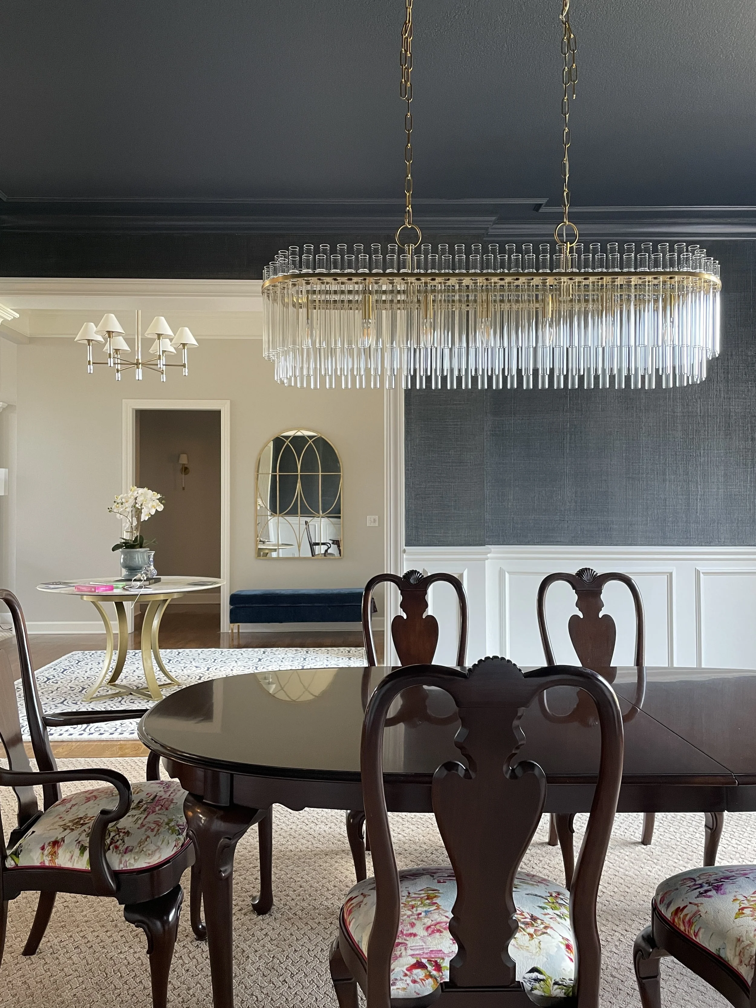 Stunning Dining Room Design with Custom Upholstered Romo Fabric Chairs and Glass Chandelier in Venice Florida