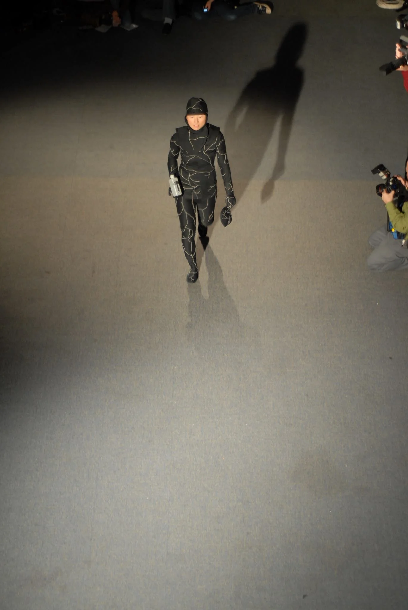 Image of Coeio founder , Jae Rhim Lee, in the mushroom suit prototype