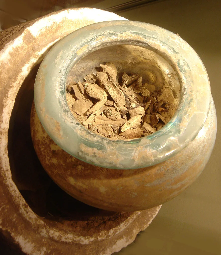 Image of cremation remains in a small jar