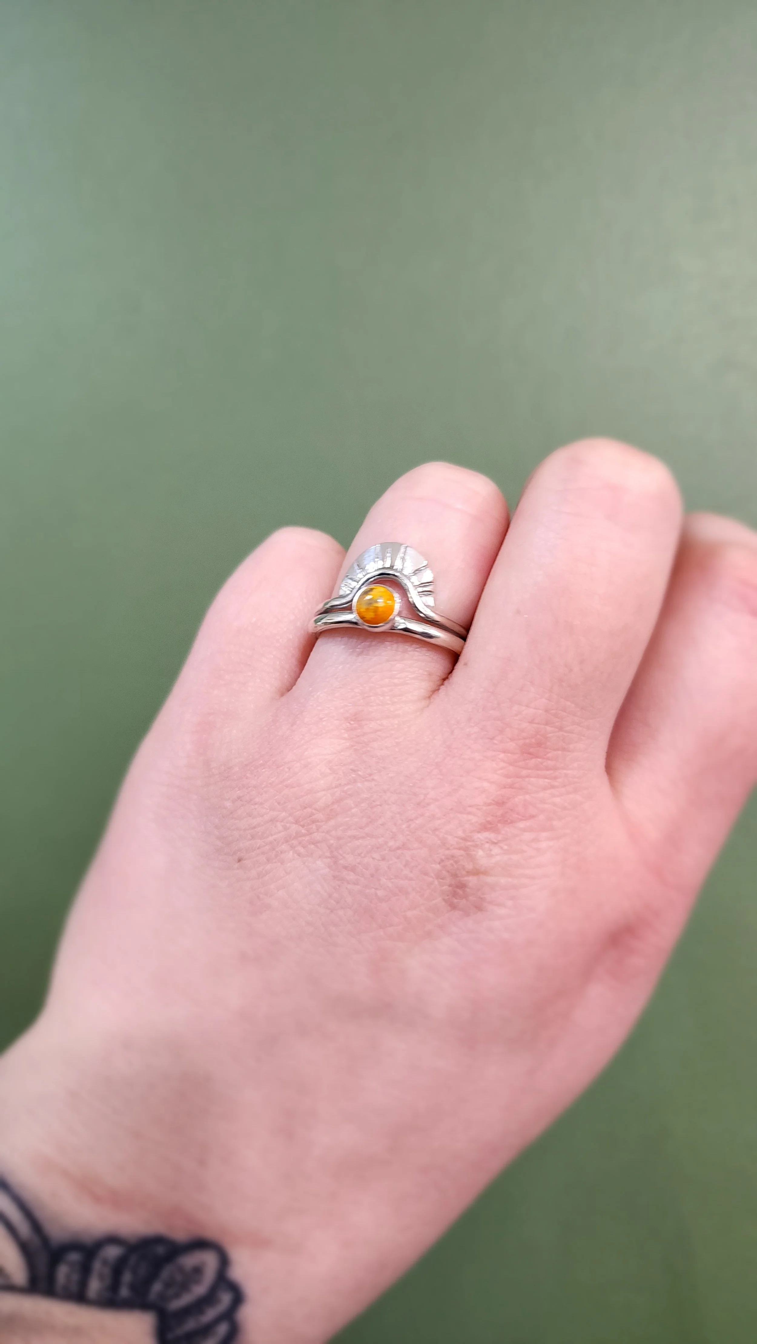 Handmade sterling silver ring featuring a customer-picked jasper stone and stamped details. Fire and Fringe custom jewelry emphasizing unique artisan craftsmanship