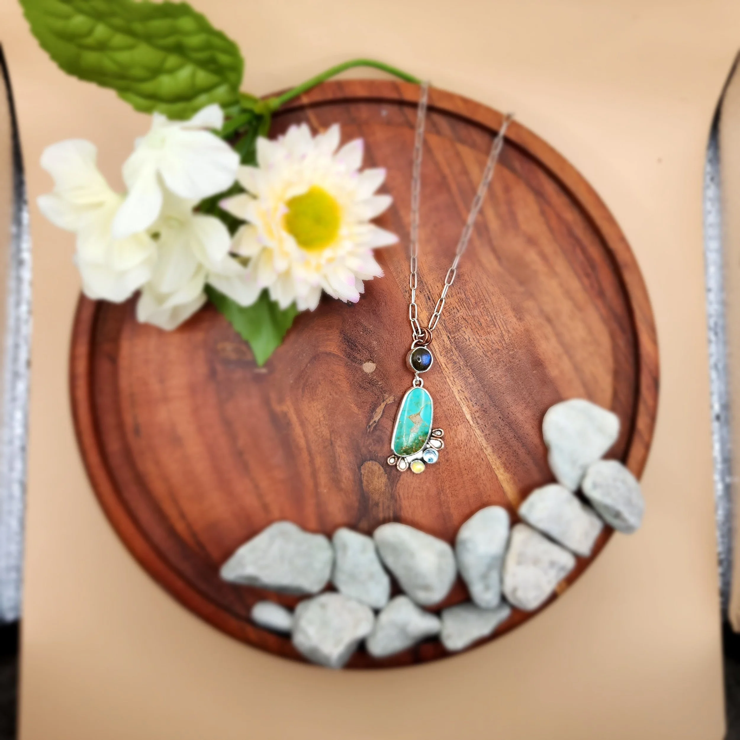 Custom sterling silver and birthstone necklace by Fire and Fringe. Handmade artisan jewelry featuring natural materials and personalized design for unique keepsakes