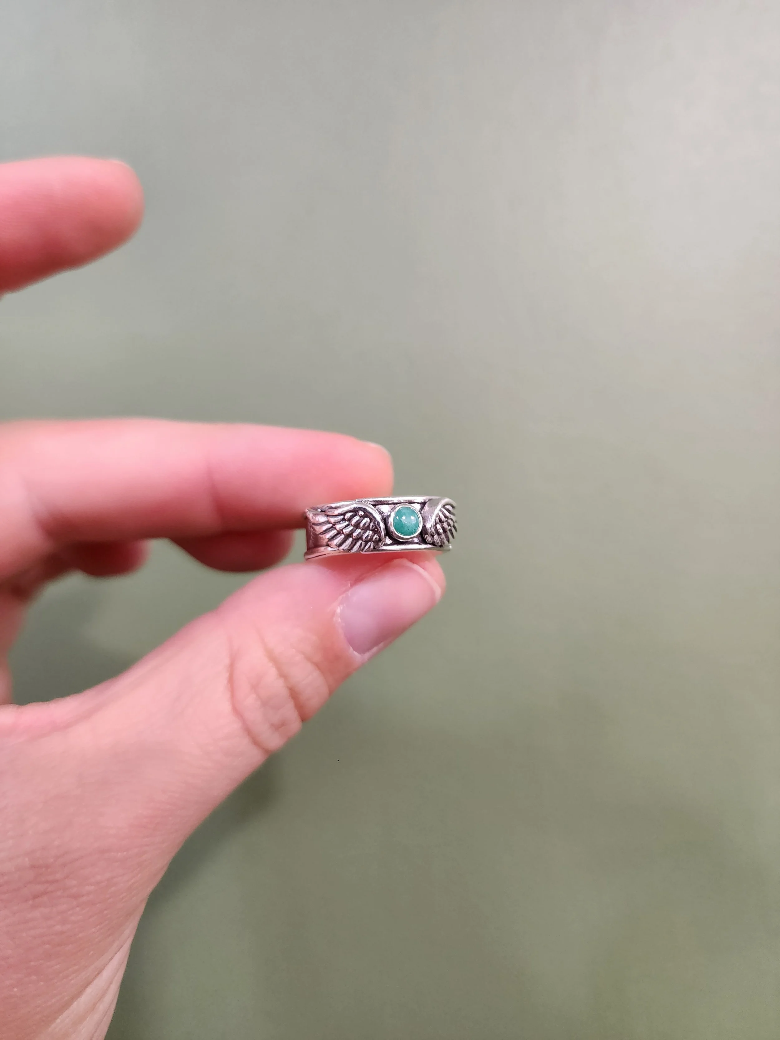 Custom sterling silver ring memorial ring with birthstone and customer names. Fire and Fringe artisan jewelry highlighting handmade, personalized, and heirloom-quality craftsmanship