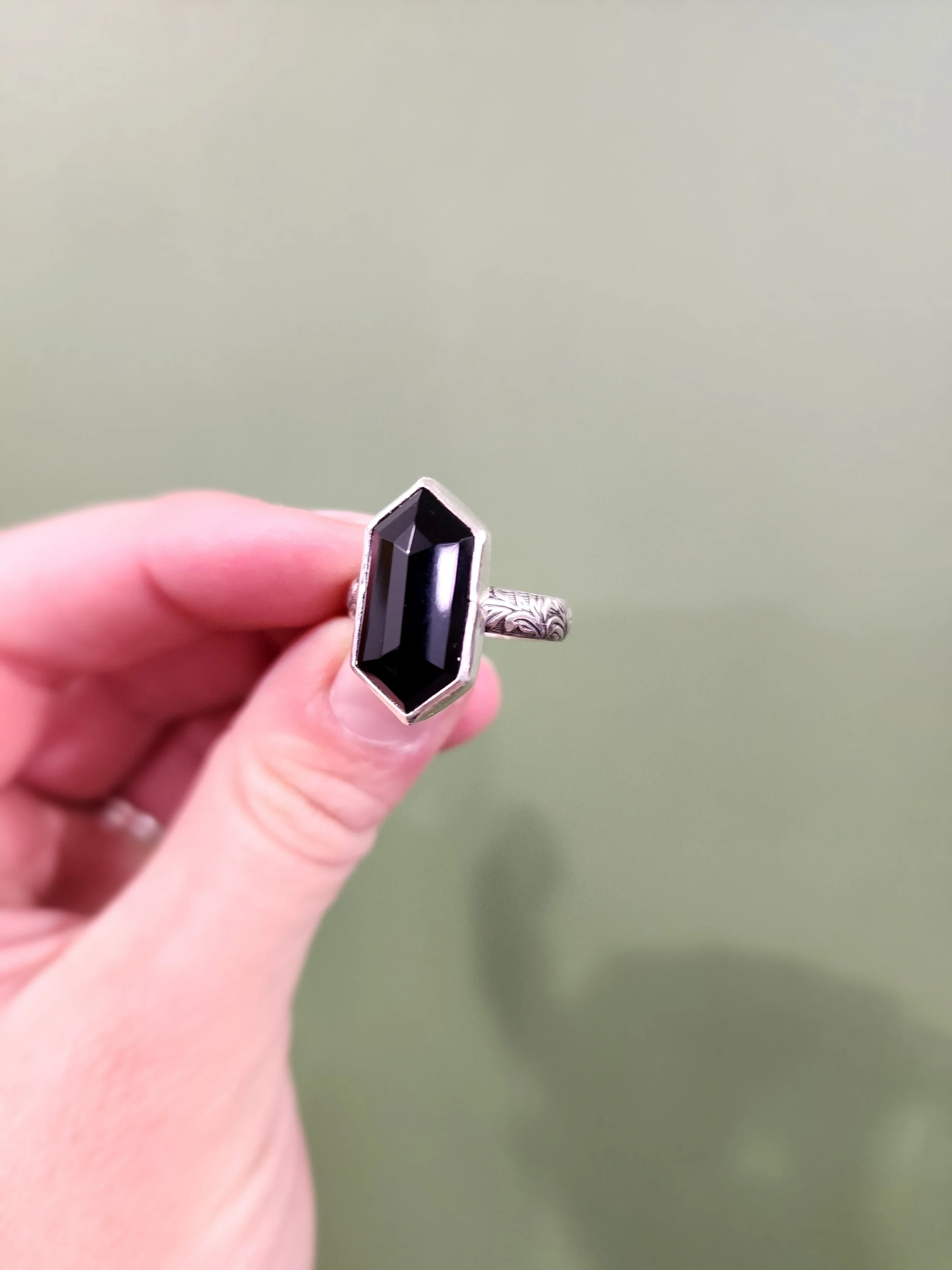 Customer-selected onyx set in a handmade sterling silver ring by Fire and Fringe. Custom jewelry design emphasizing artisan techniques and heirloom-quality pieces.