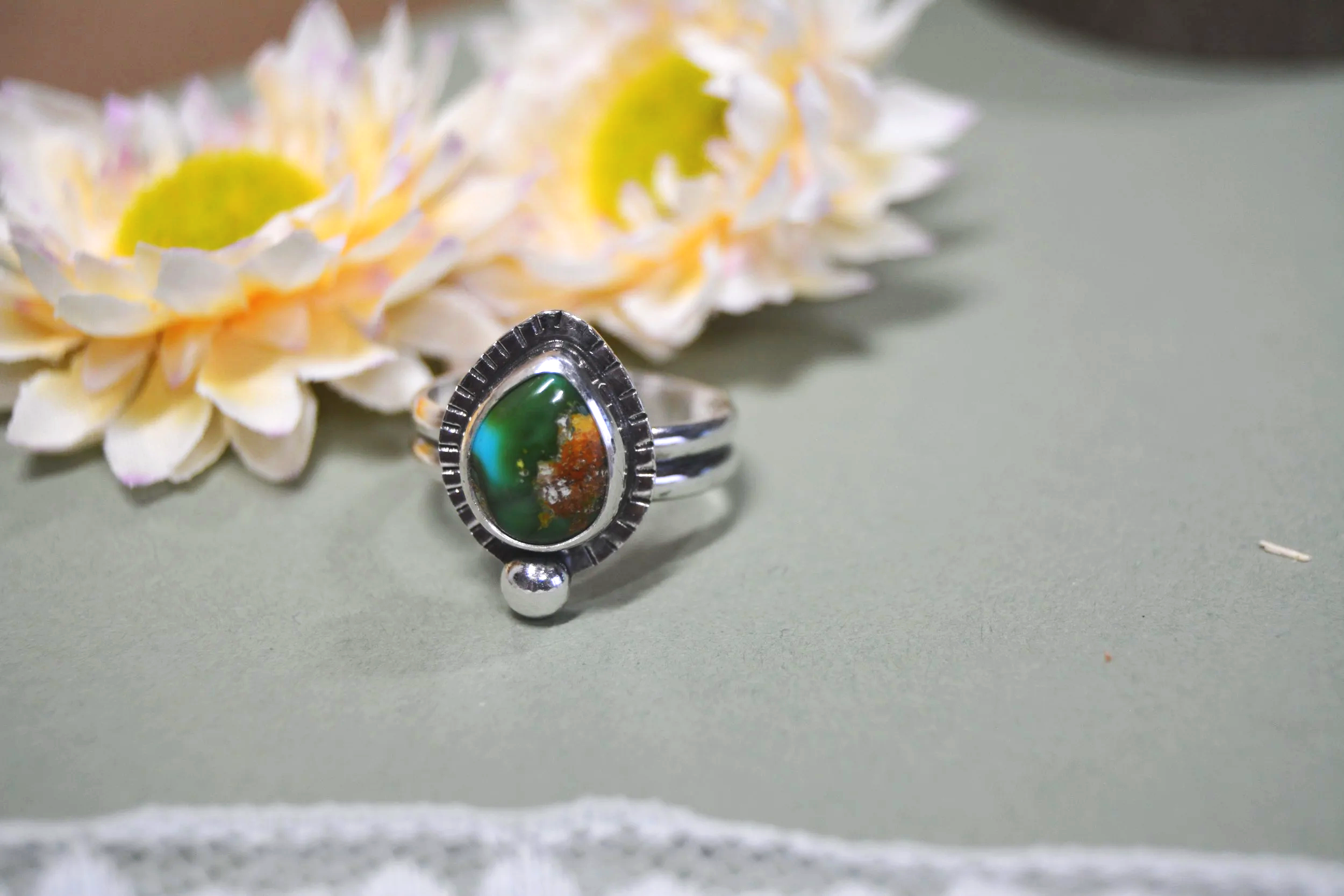 Sonora Gold Turquoise ring with hand stamped boarder and pebble accent. 