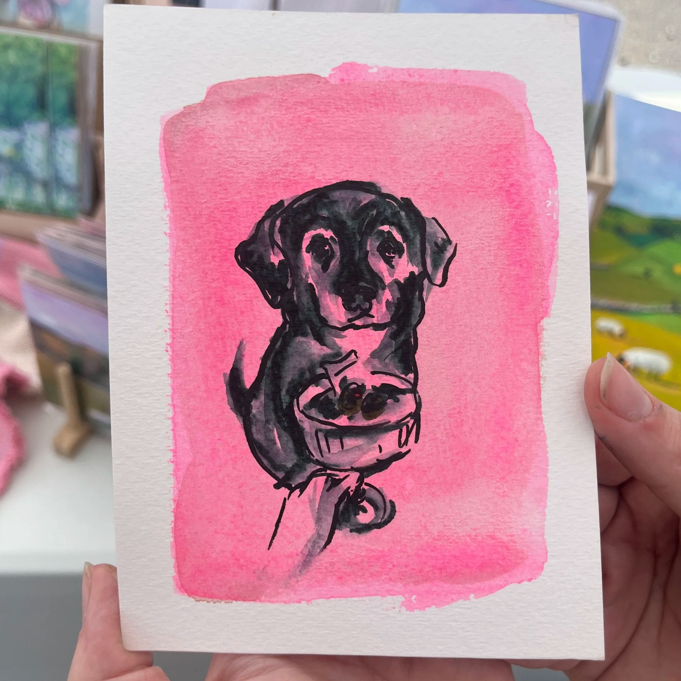 Hands holding a portrait of a dog on a bright pink background. In the illustration, a hand is holding up a martini glass in front of the dog.