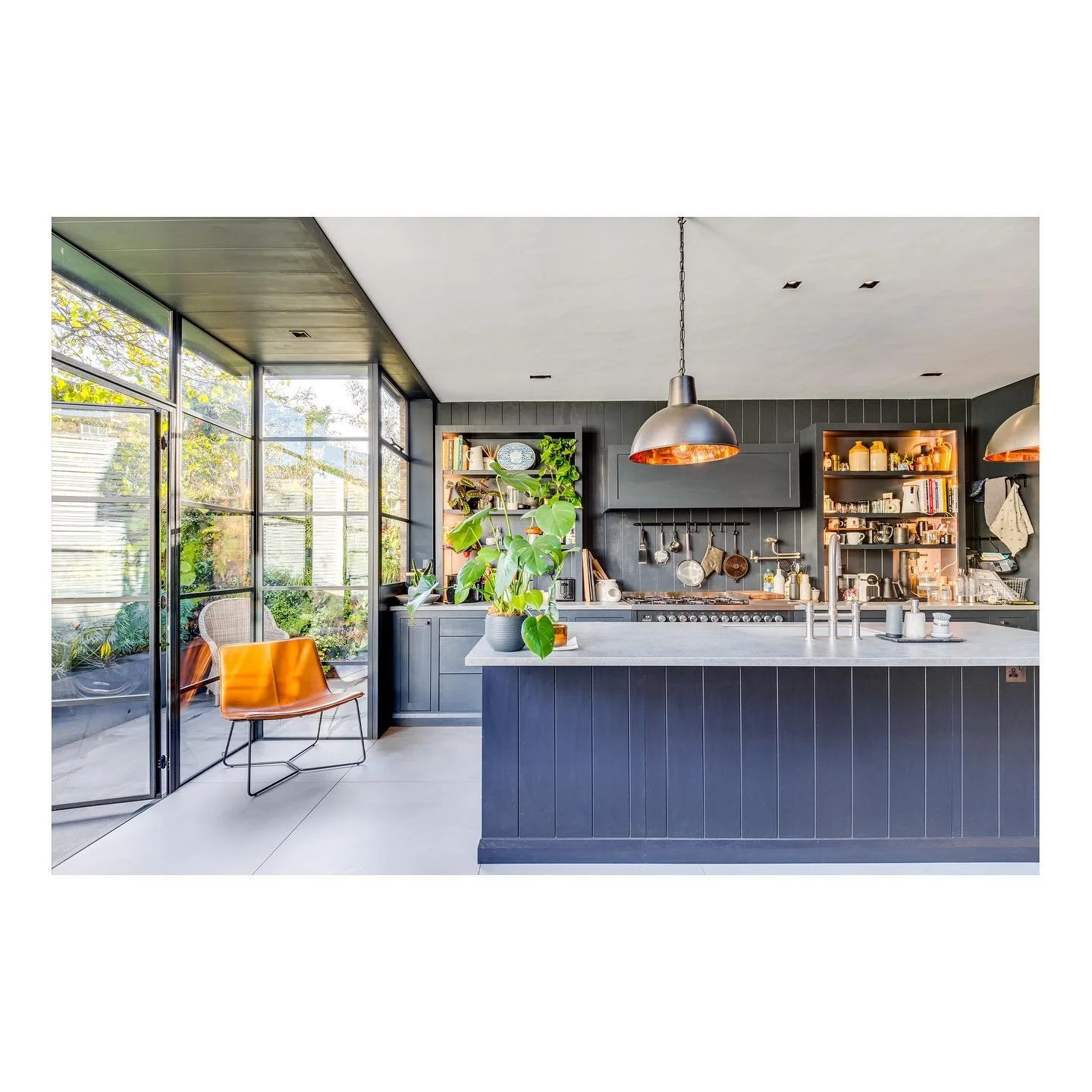 Love a working kitchen 🔪 Especially when the garden is framed with Crittal doors and windows.

Designed by and photography for @simon_merrony_architects 
&bull;
&bull;
#interiorphotography #interiordesign #canon #minimalist #homeideas #luxuryinterio