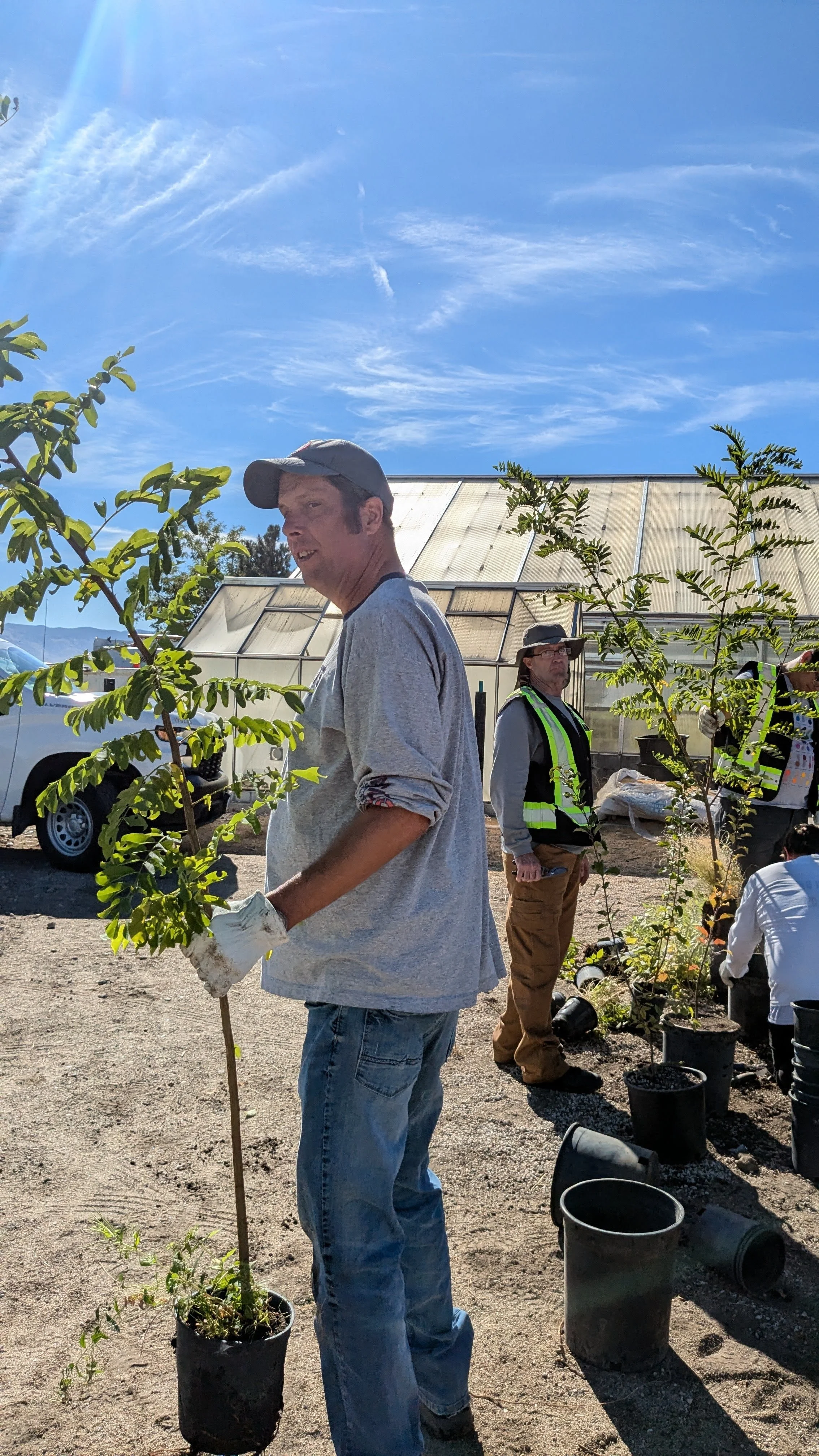 one truckee river workforce development supervisor ian redinbaugh planting 2 tree sapplings