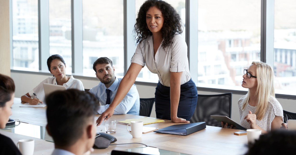 female CEO in the middle of the table