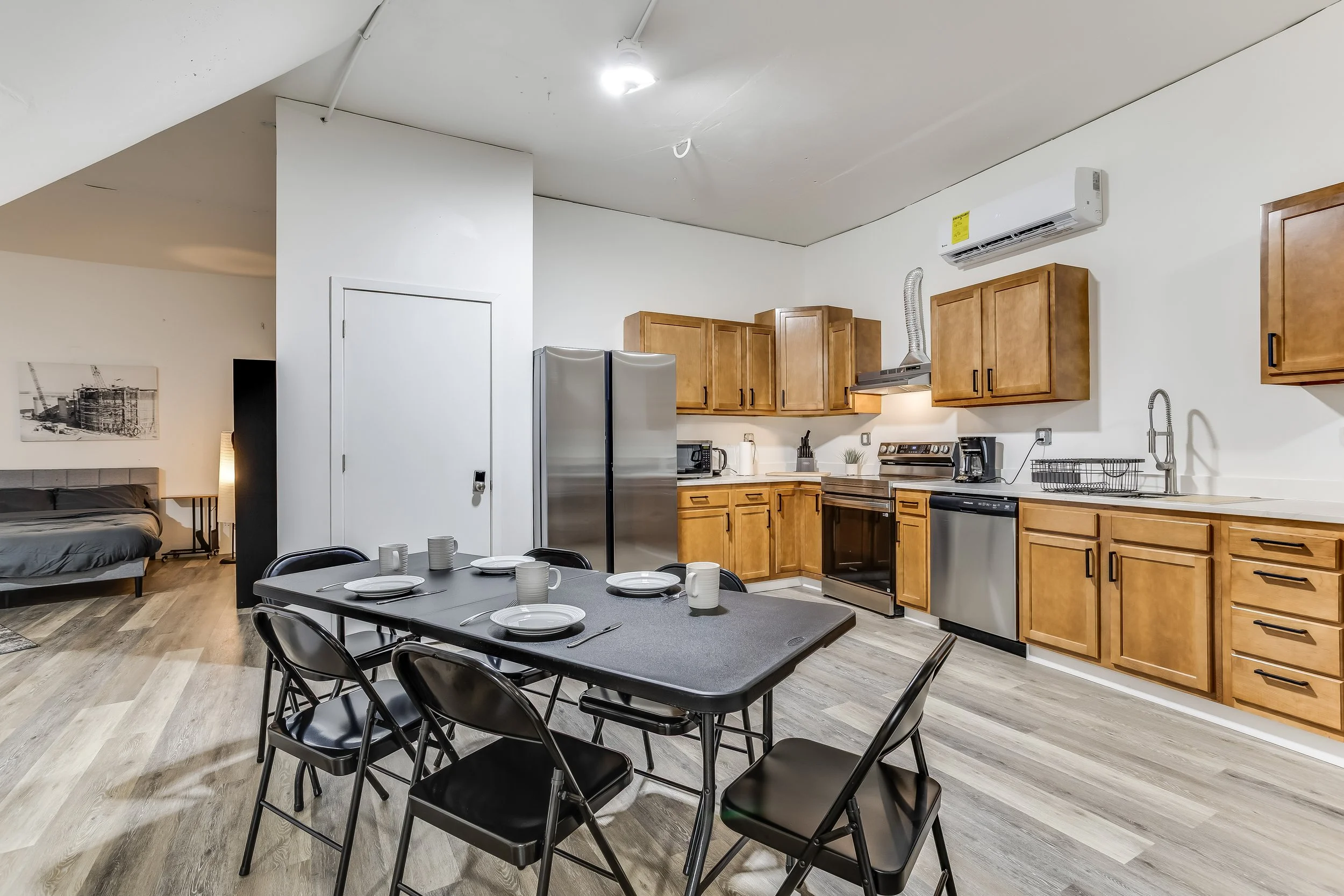 Open-concept kitchen, dining, and sleeping area inside the missile silo, fully equipped for group stays and unique overnight getaways.