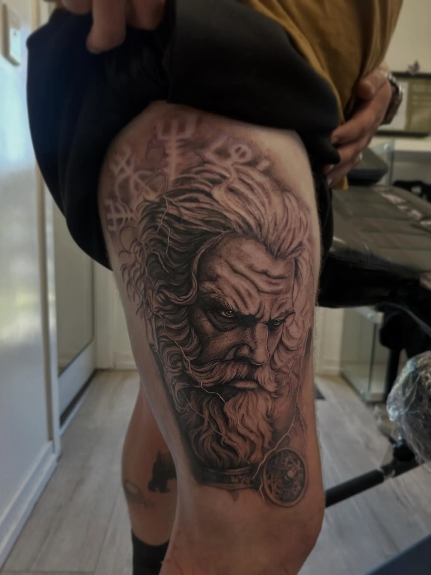 More progress on @regan.todd &lsquo;s leg sleeve ⚡️ 
.
.
.
.
#realismtattoo #blackandgray #tattoo #vikingtattoo