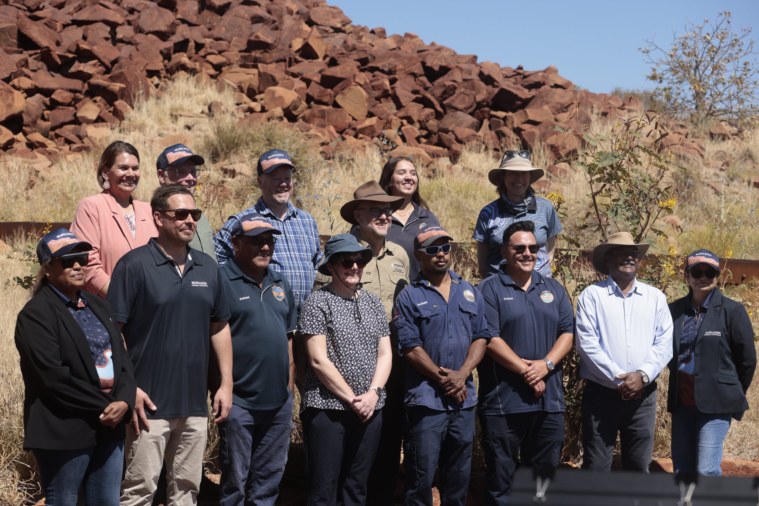 Murujuga Aboriginal Corporation Rangers with federal and state Environment Ministers Murray Watt and Matthew Swinbourn, respectively, and scientists involved in the Murujuga Rock Art Monitoring Program.
