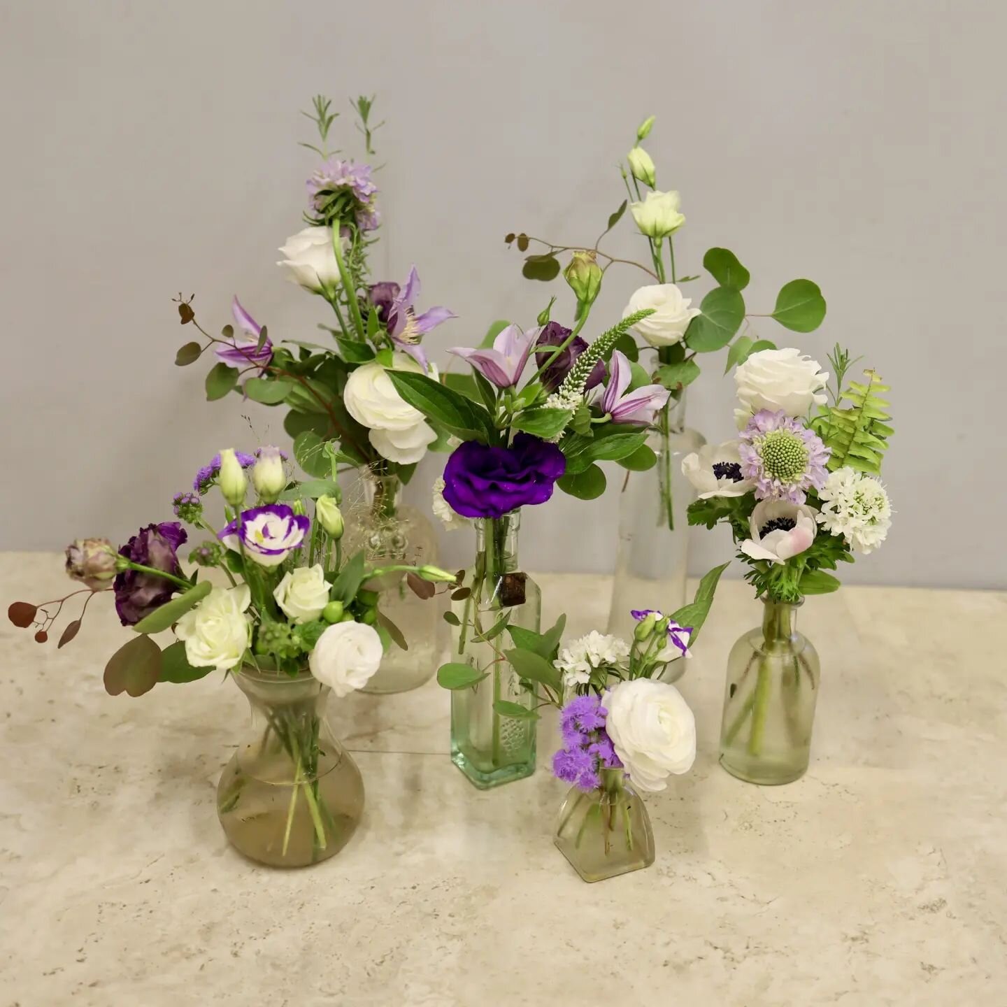 Here's a fresh mockup we designed in a collection of apothecary bottles

#purpleflowers #apothecarybottles #flowercollection #floraldecor #eventdesign #mockup #longstemsevents #ranunculus #lisianthus #anemone #scabiosa