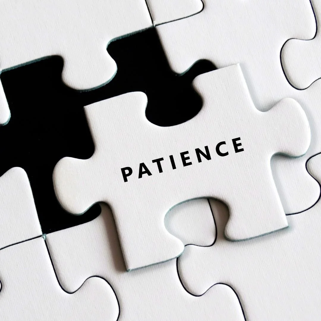 white puzzle pieces with patience as the center piece