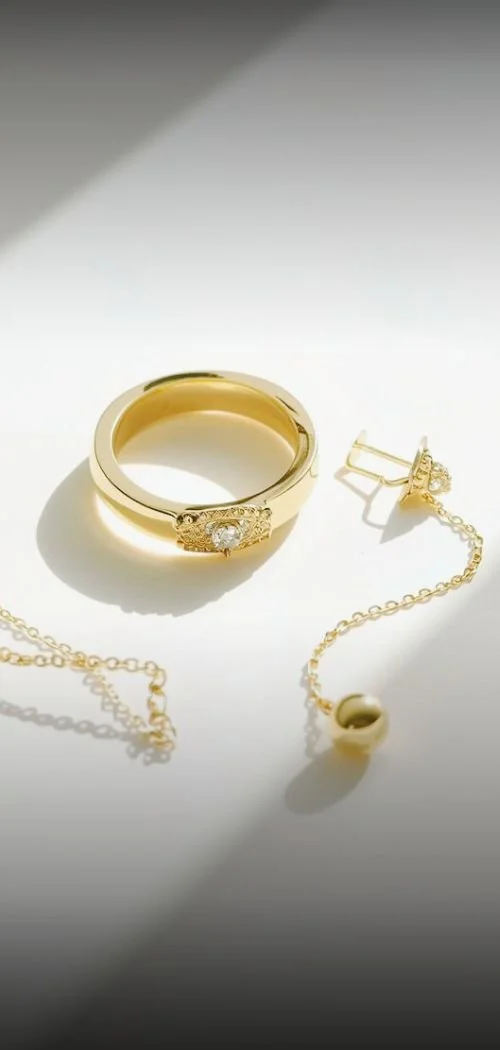 gold jewelry sparkling in the sunlight on a minimal background