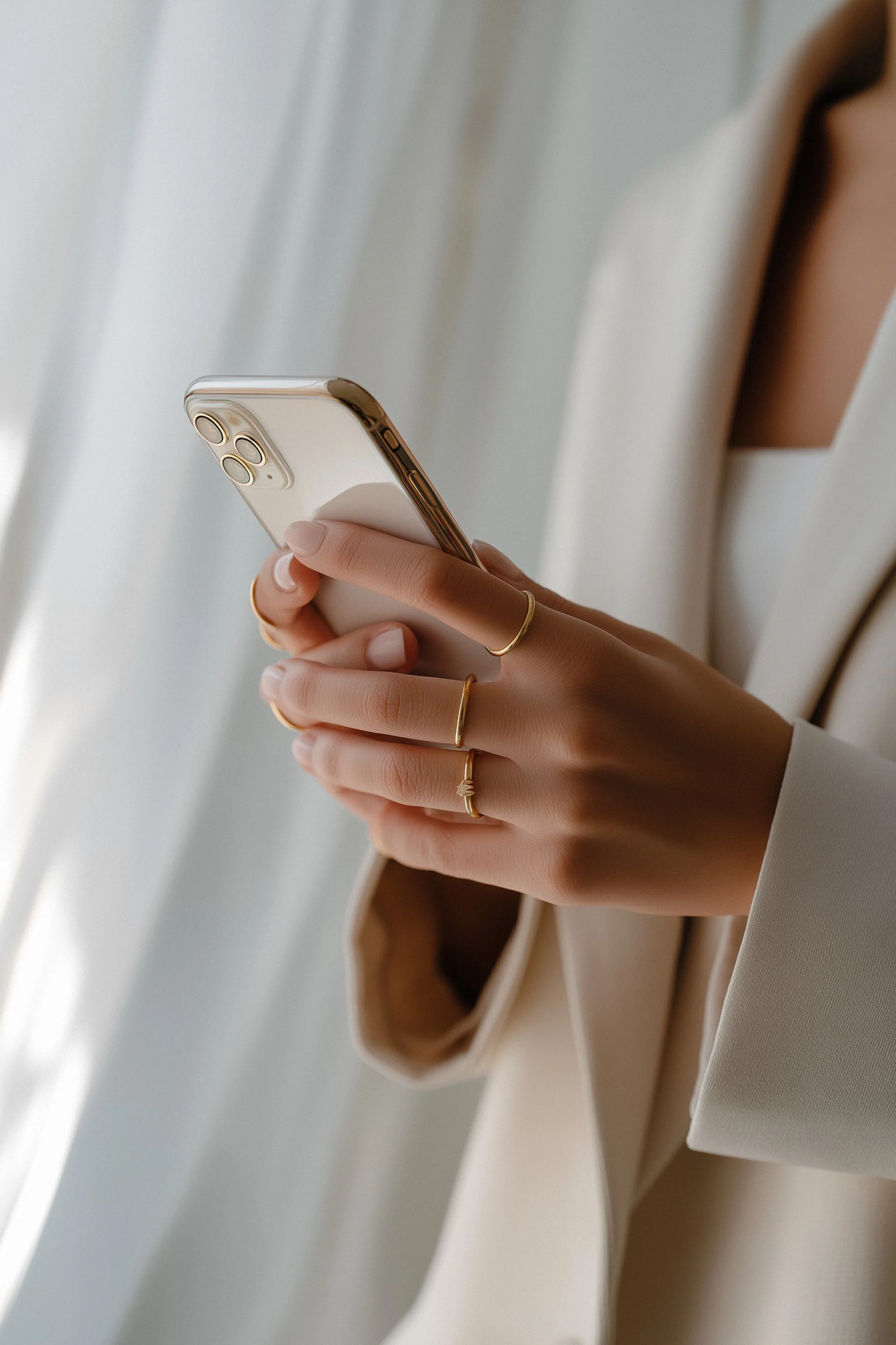 a woman on an iPhone wearing business attire