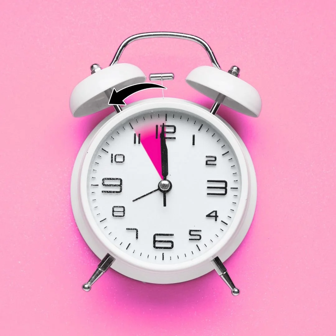 A clock reversing time on a pink background