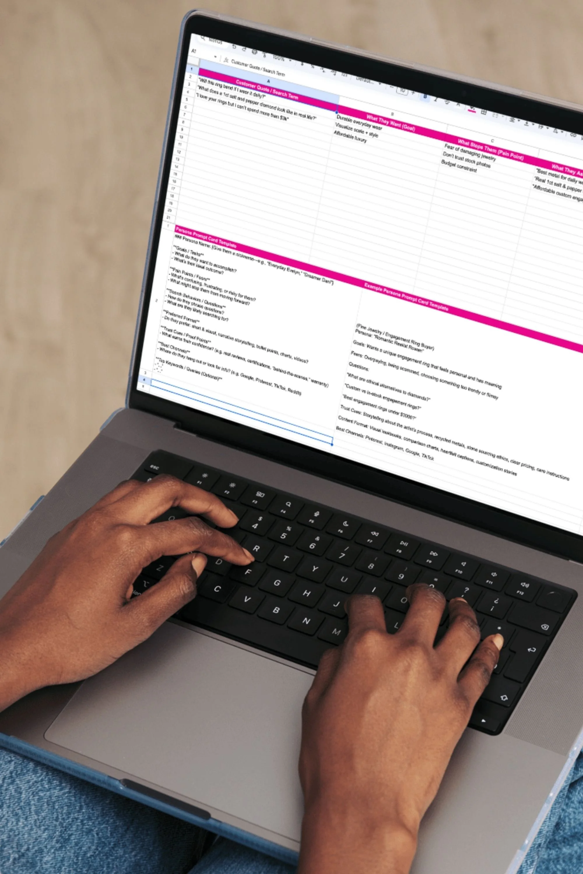 woman using the Search Persona Discovery Spreadsheet on a laptop