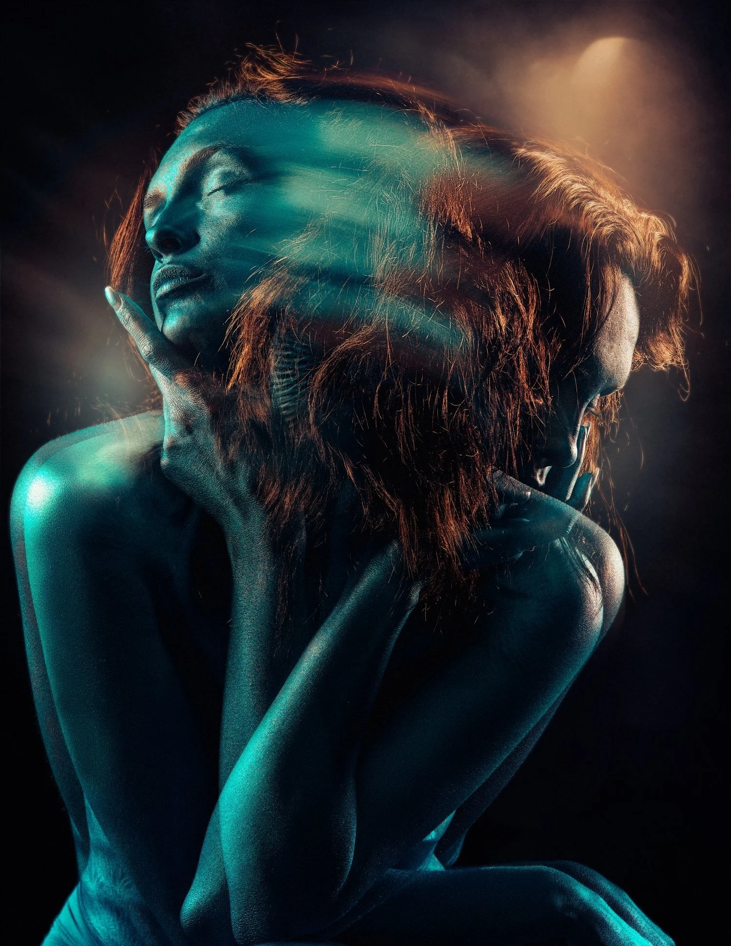 Artistic double exposure of a woman with long hair, hands near face, blue and orange lighting.