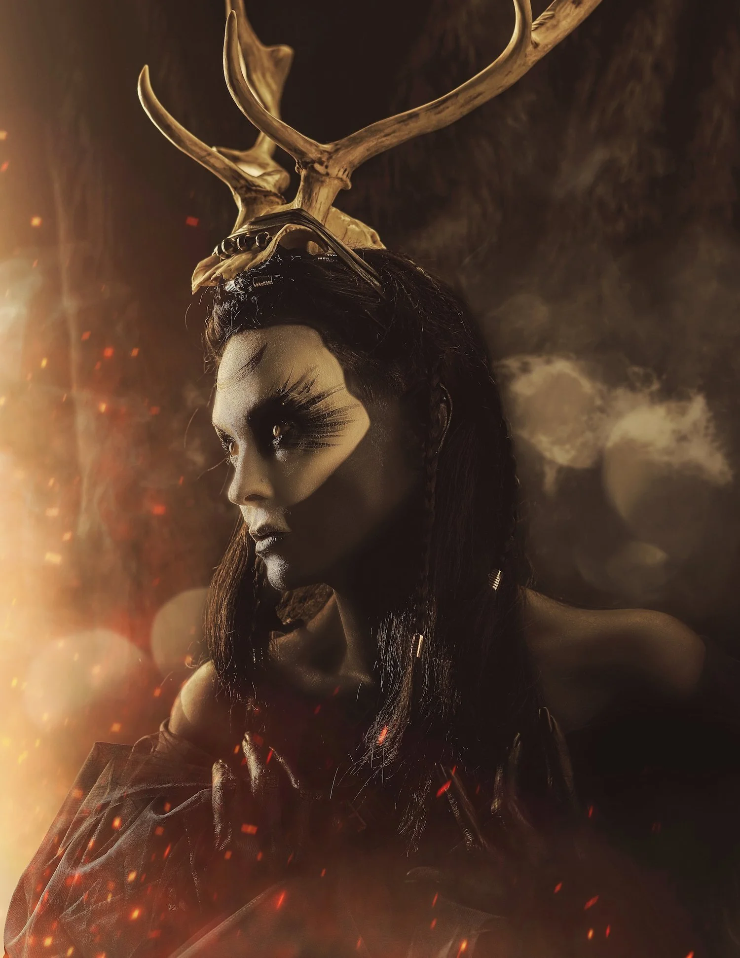 Fantasy Photo of female shaman looking at fire with horns and painted face