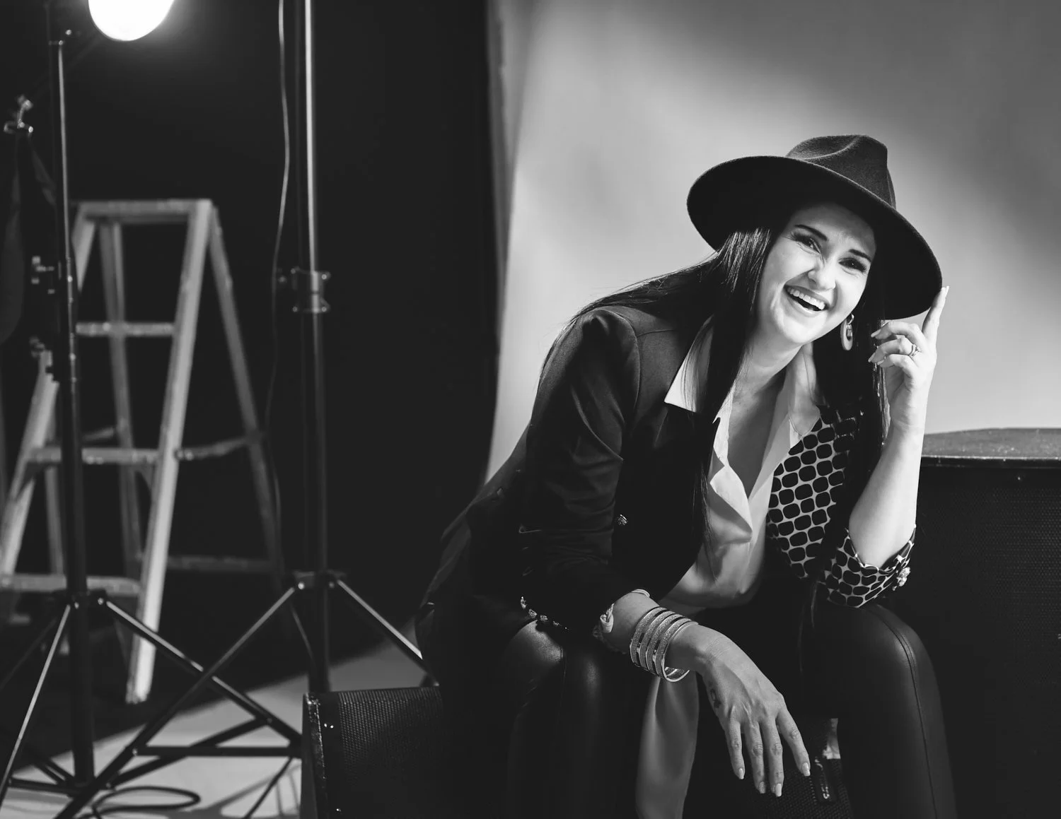 Editorial Photo of musician sitting on stage with hat