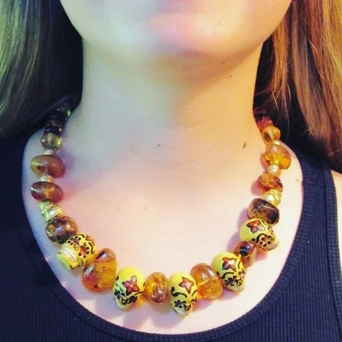 Yellow Skull Necklace - Hand-painted skulls, Amber, Citrine, and gold-plated beads.