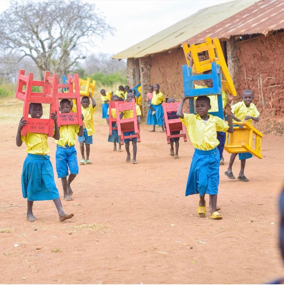 Children with chairs.png