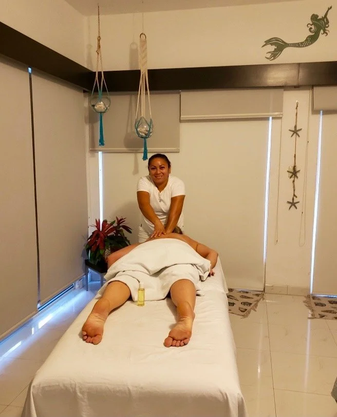 Massage therapist providing a relaxing in-villa massage at a beachfront vacation rental in Cozumel