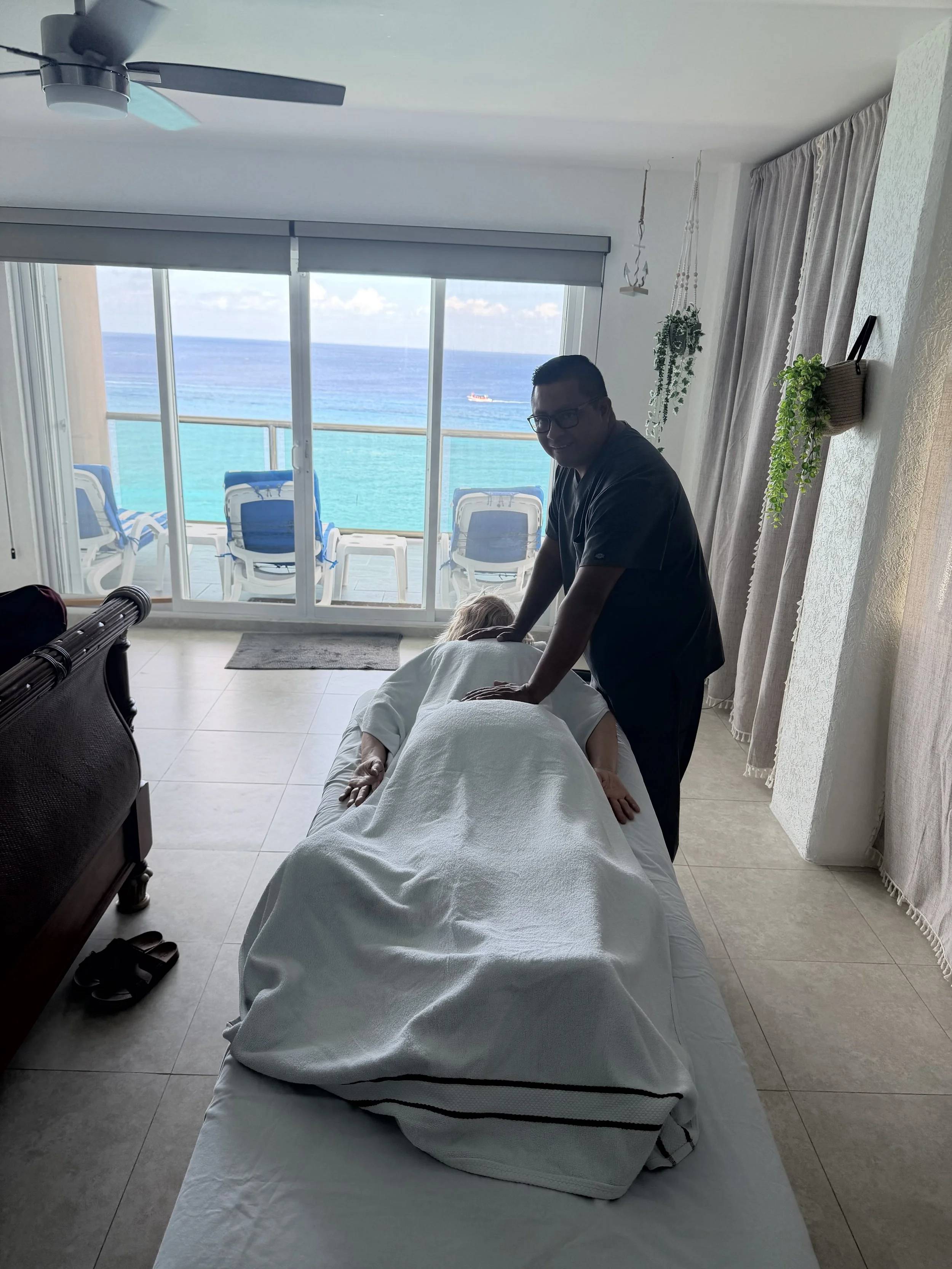 In-room massage at a We’ve Gone Coastal Cozumel vacation rental with Caribbean Sea views