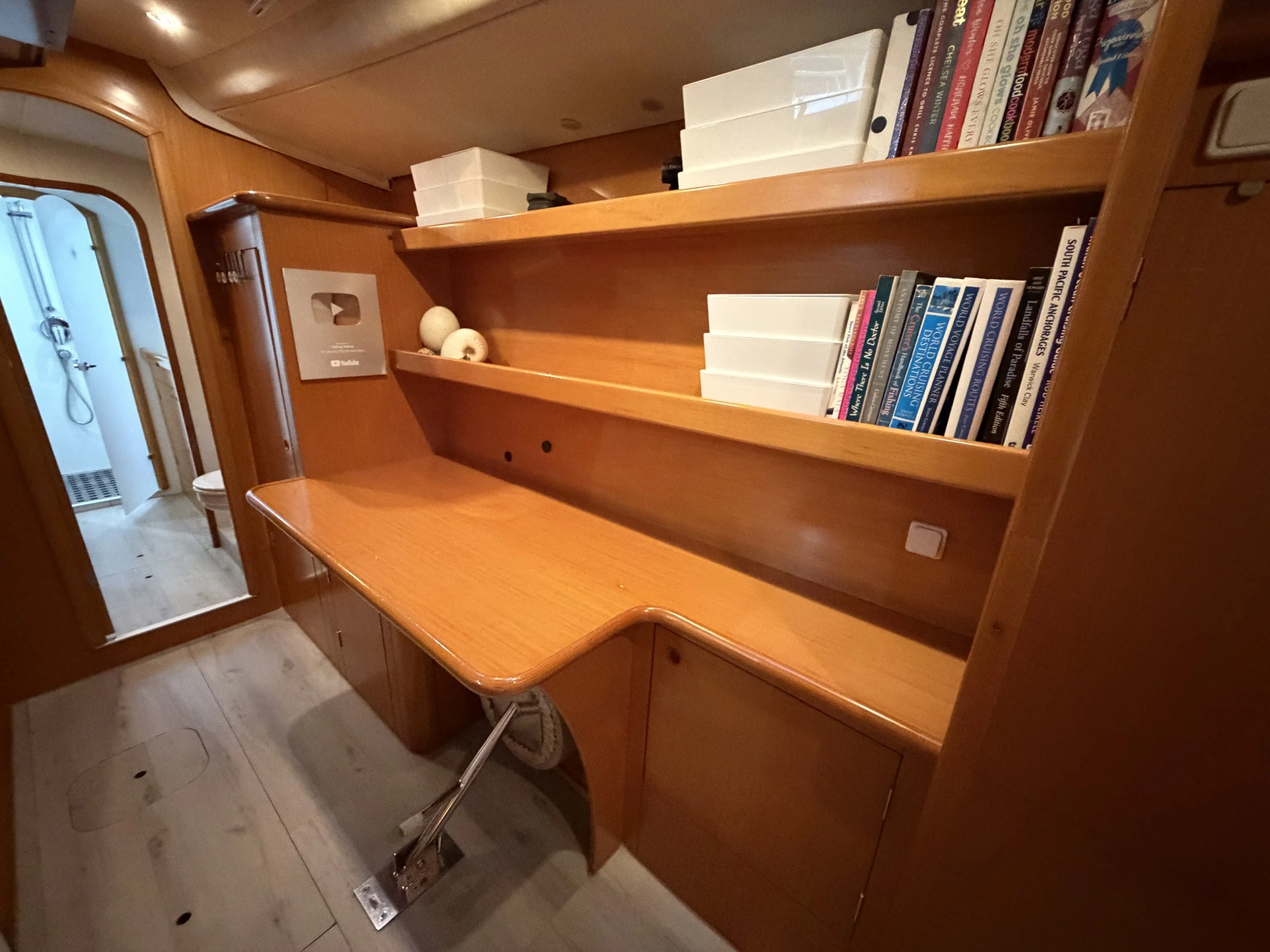 Desk, shelving and storage in the owner’s hull.