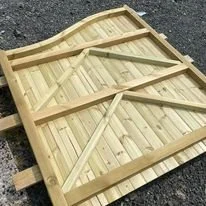 Wooden gate or fence panel lying on the ground