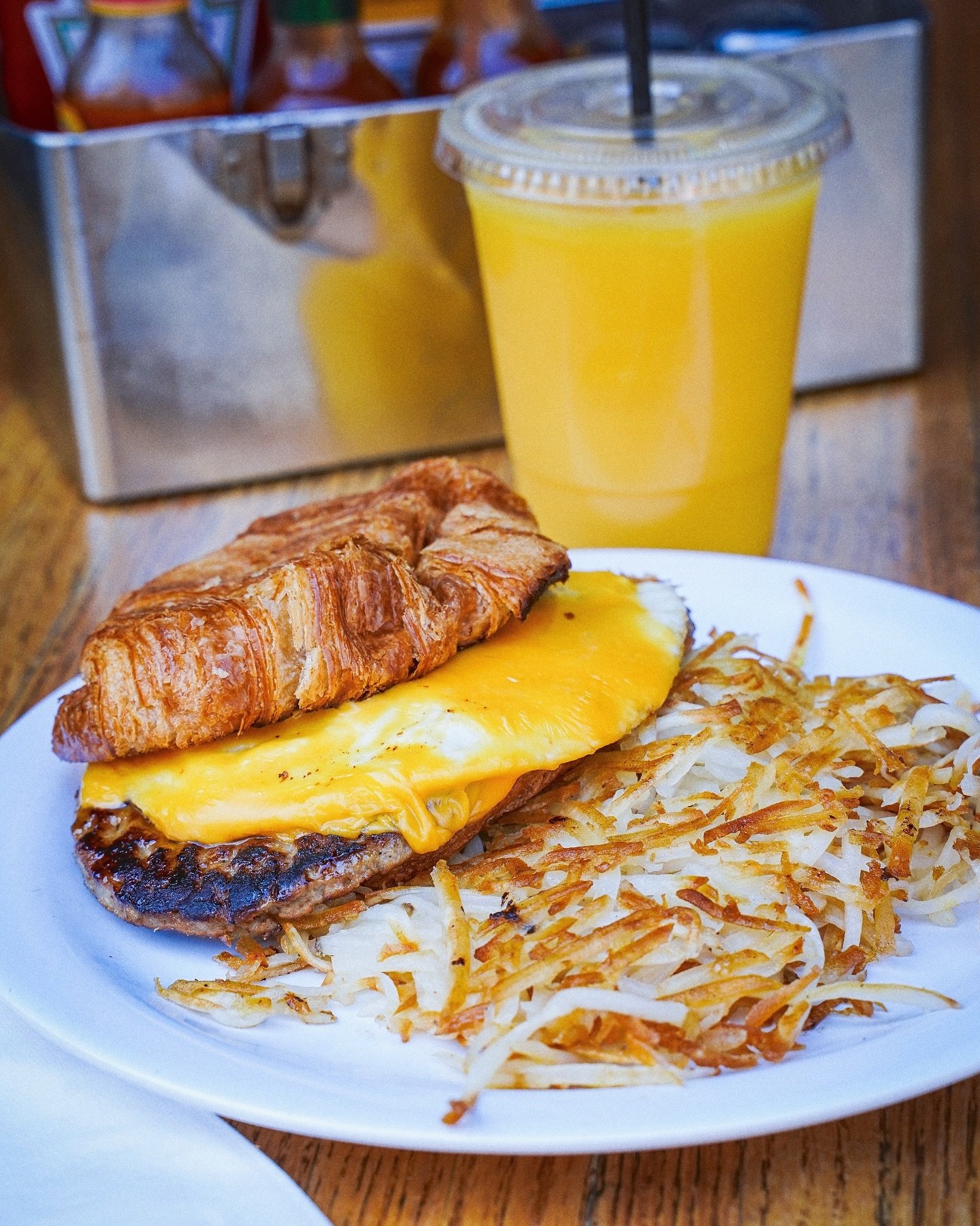 Brighten up your day with our Breakfast Croissant Sandwich special! 🥐 Made with two eggs any style, maple grilled sausage patty and American cheese.