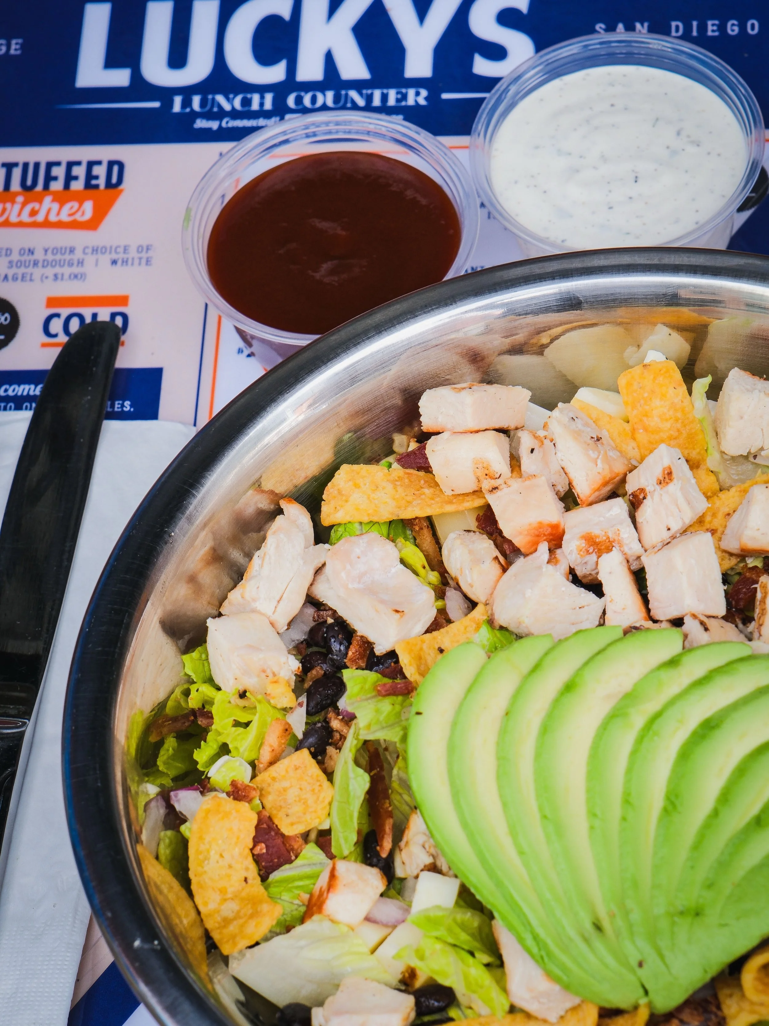 Keep it light and LUCKY with our bbq chicken salad!🍀🥗

made with romaine lettuce, grilled chicken, sweet corn, black beans, avocado, bacon, red onion, fritos and pepper jack cheese in a bbq ranch dressing.