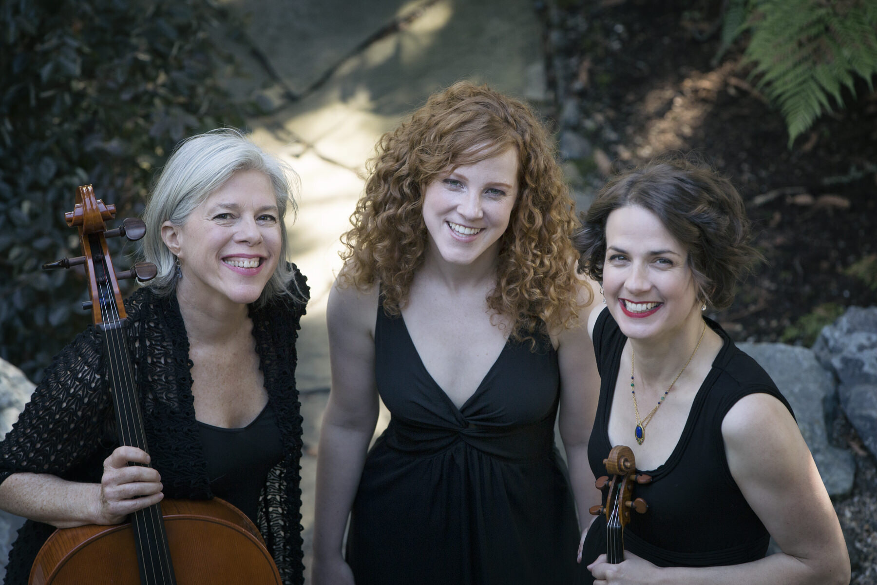+closeup headshot at with cello and violin.jpg