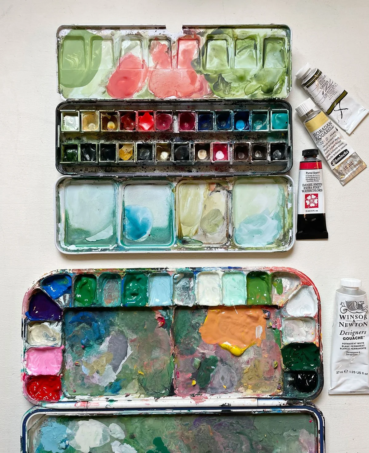 my watercolour and gouache paint palette is messy and muddy just the way I like it